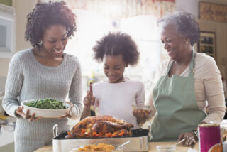 Generations of families enjoy a Thanksgiving turkey.