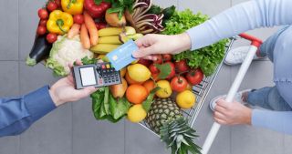 Shoppers using their grocery store gift certificate for easy checkout at their favorite retailers.