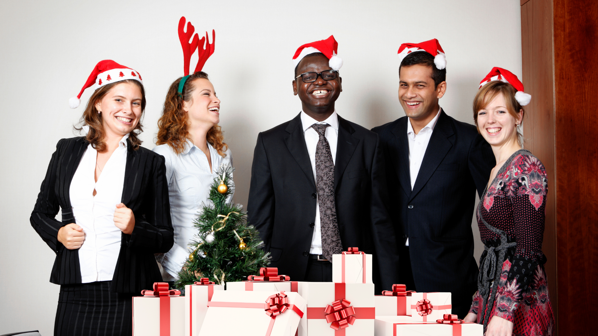 Employees celebrating with holiday gift certificates and turkey gift cards